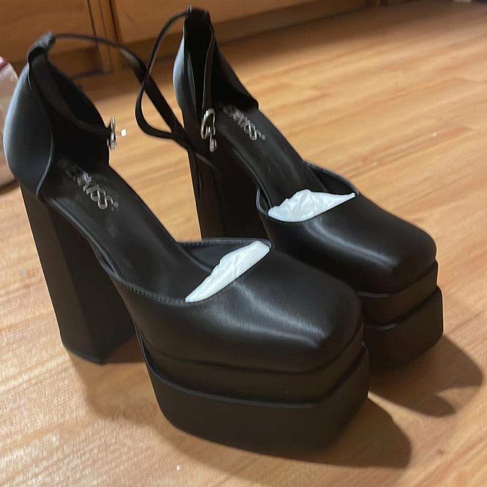 Black satin platform heels with ankle straps